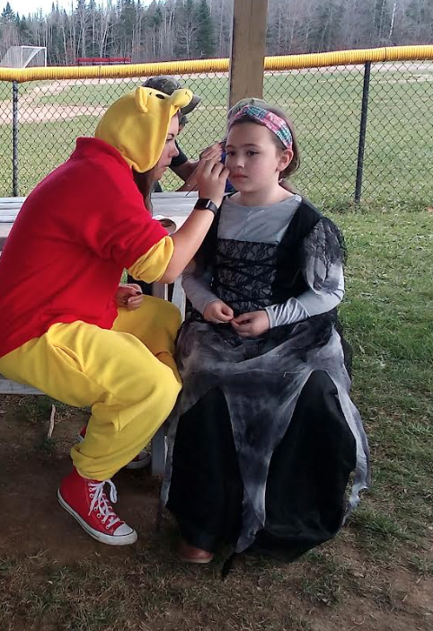 KMHS students painting KES faces for Halloween